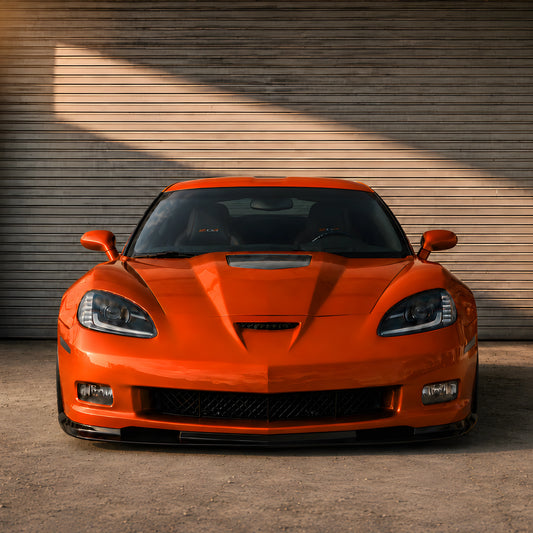 Orange Corvette front bumper cover with central grille and lower air opening