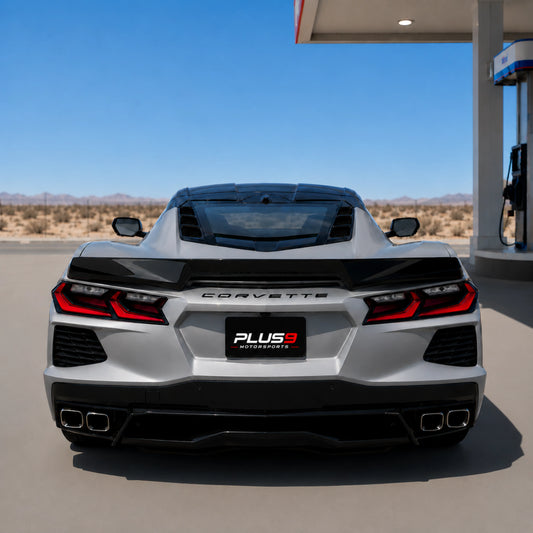 Rear ducktail spoiler on rear of sports car, glossy black aerodynamic fins