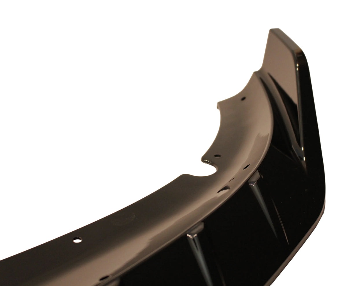 Black SRT-style front lip spoiler inner edge with mounting holes