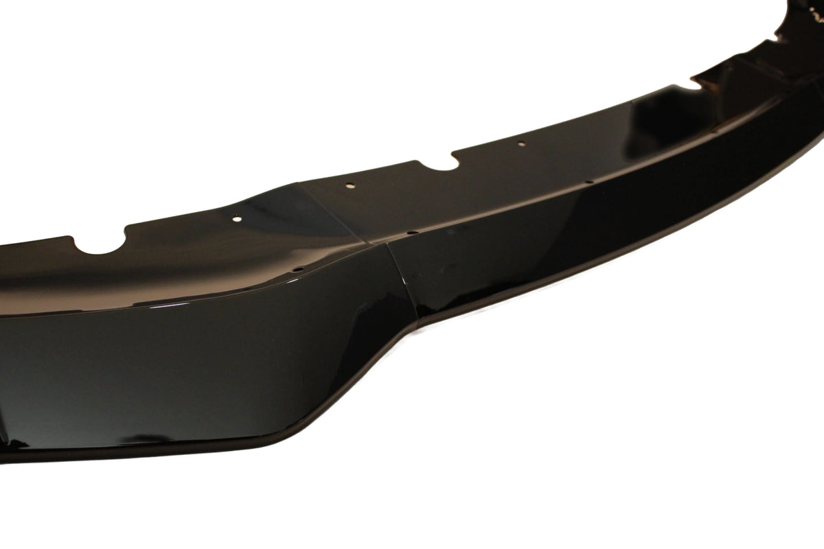 Black front lip spoiler segment with center seam and mounting holes