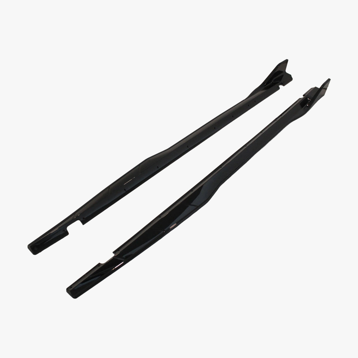 Black side skirt extension panels with mounting holes, angled view