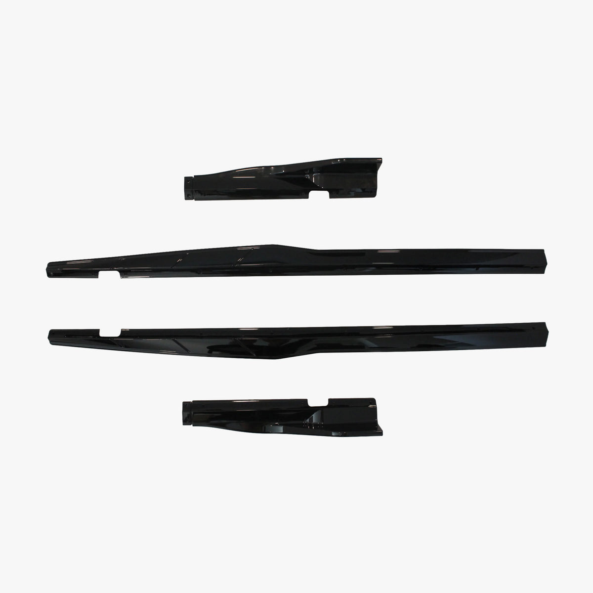 Set of black side skirt extension panels, multiple pieces shown