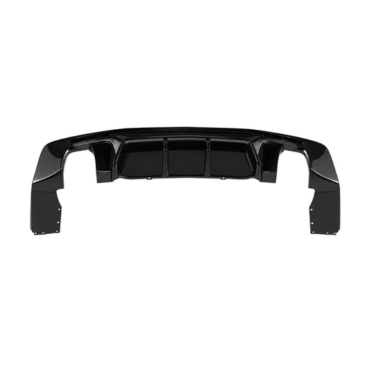 Black rear bumper diffuser trim with slatted grille and curved side cutouts