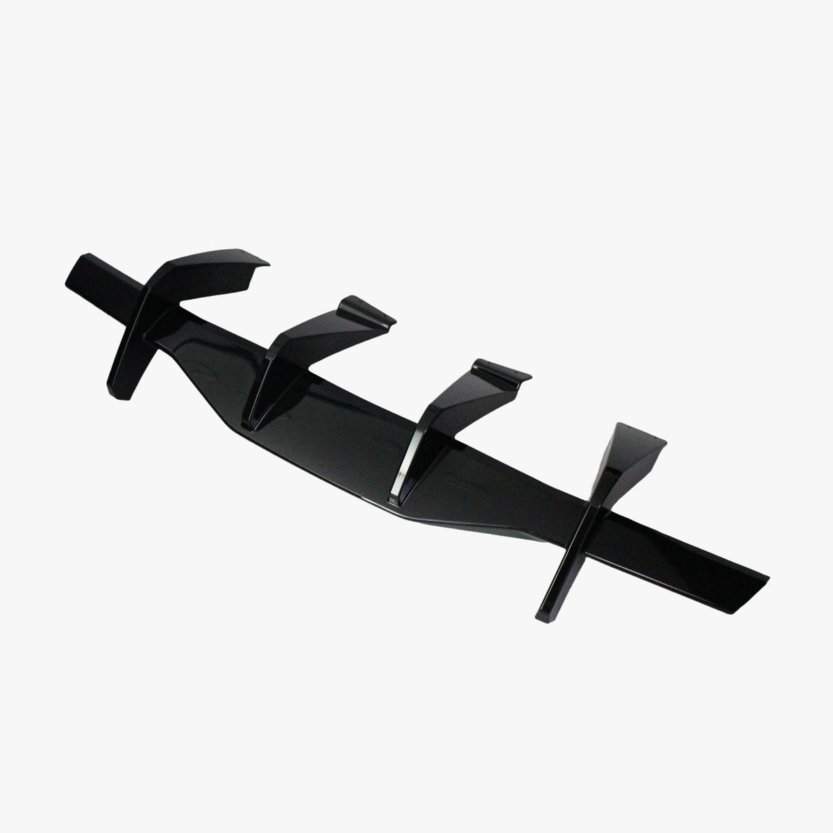 Matte black rear diffuser lip add-on with four fin mounts and central channel