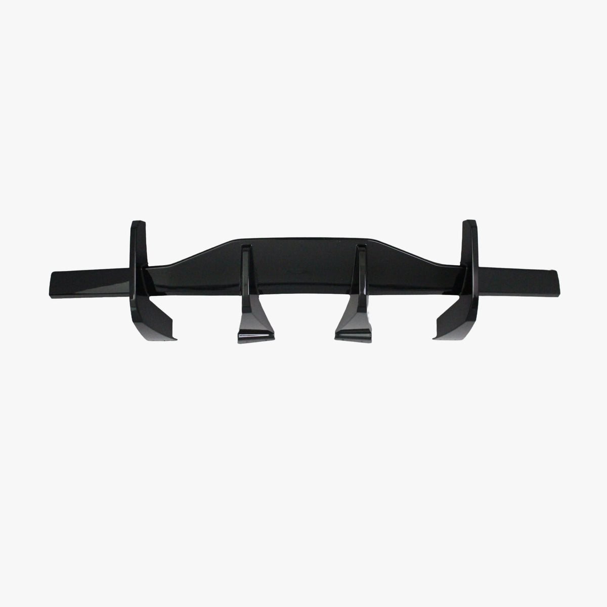 Matte black rear diffuser lip with four molded fins and side supports