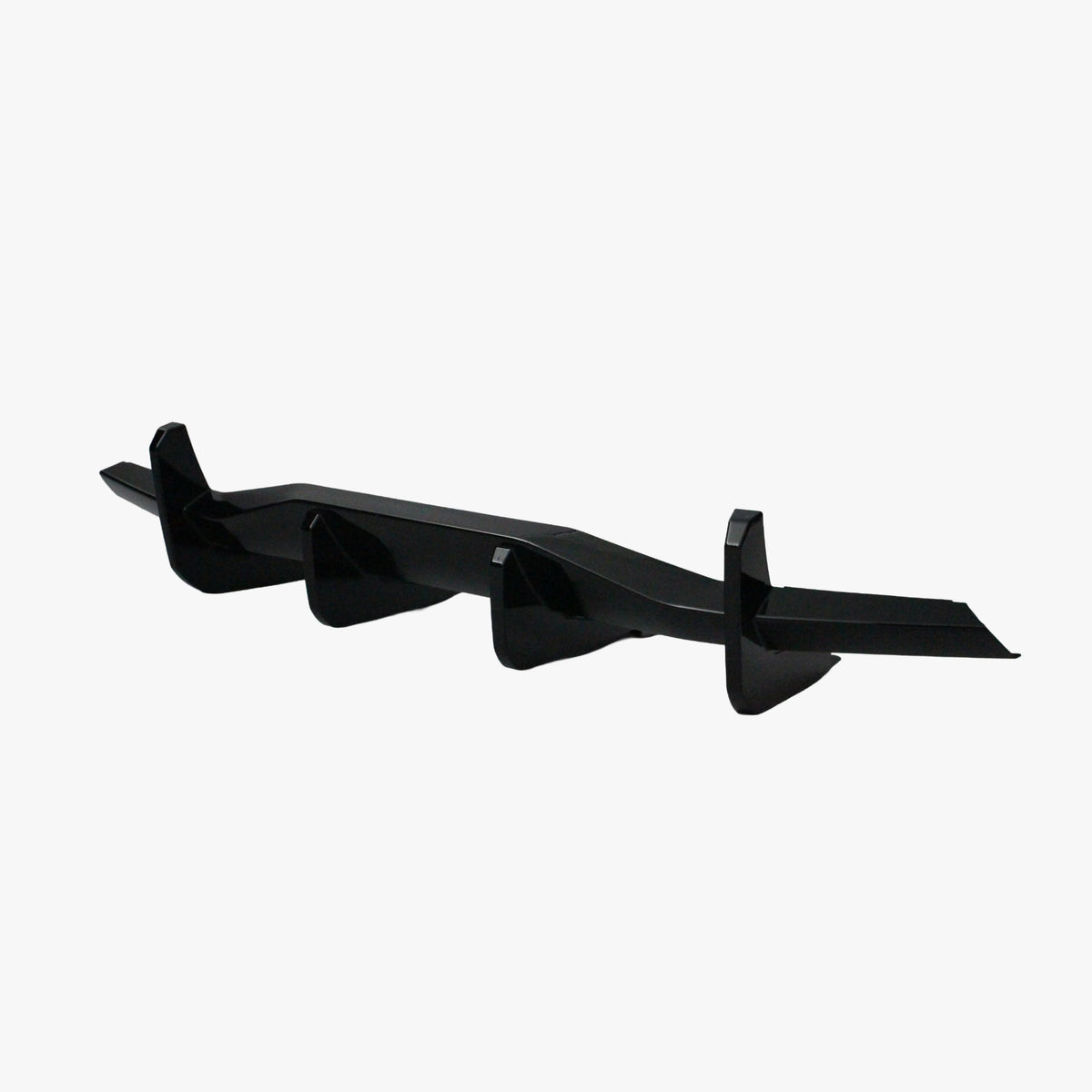Matte black rear diffuser lip add-on with angular finlets and side brackets