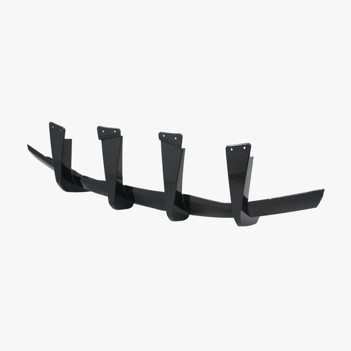Matte black rear diffuser lip add-on with four vertical fins and mounting holes